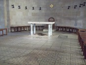The rock under the altar was Jesus' table when he multiplied the bread and fish. It's been moved a few times, so this is probably not the spot where it happened.